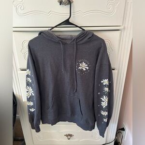 grey sweatshirt from macy’s with flowers on sleeves and top. size m in womens